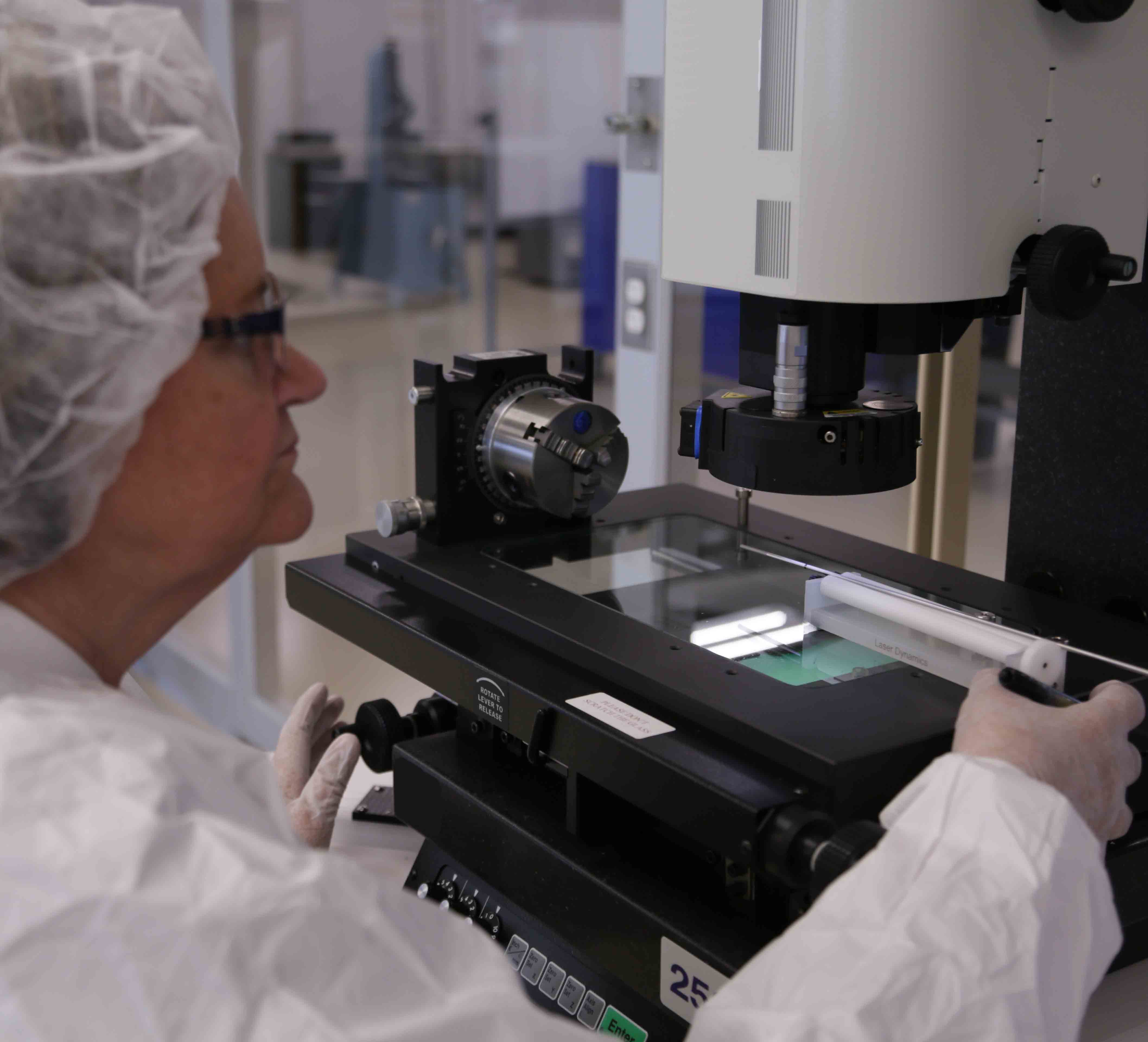 A laser operator using an inspection software loaded on the computer to see measurements of the part