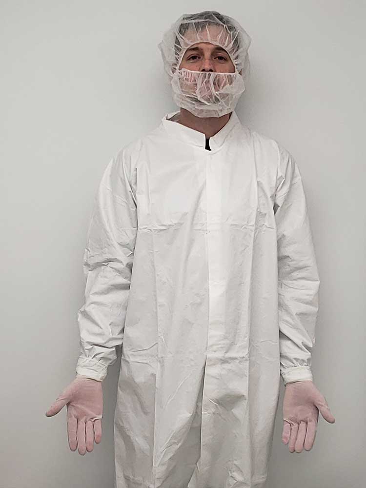 laser operator in full ISO 7 cleanroom gowning equipment