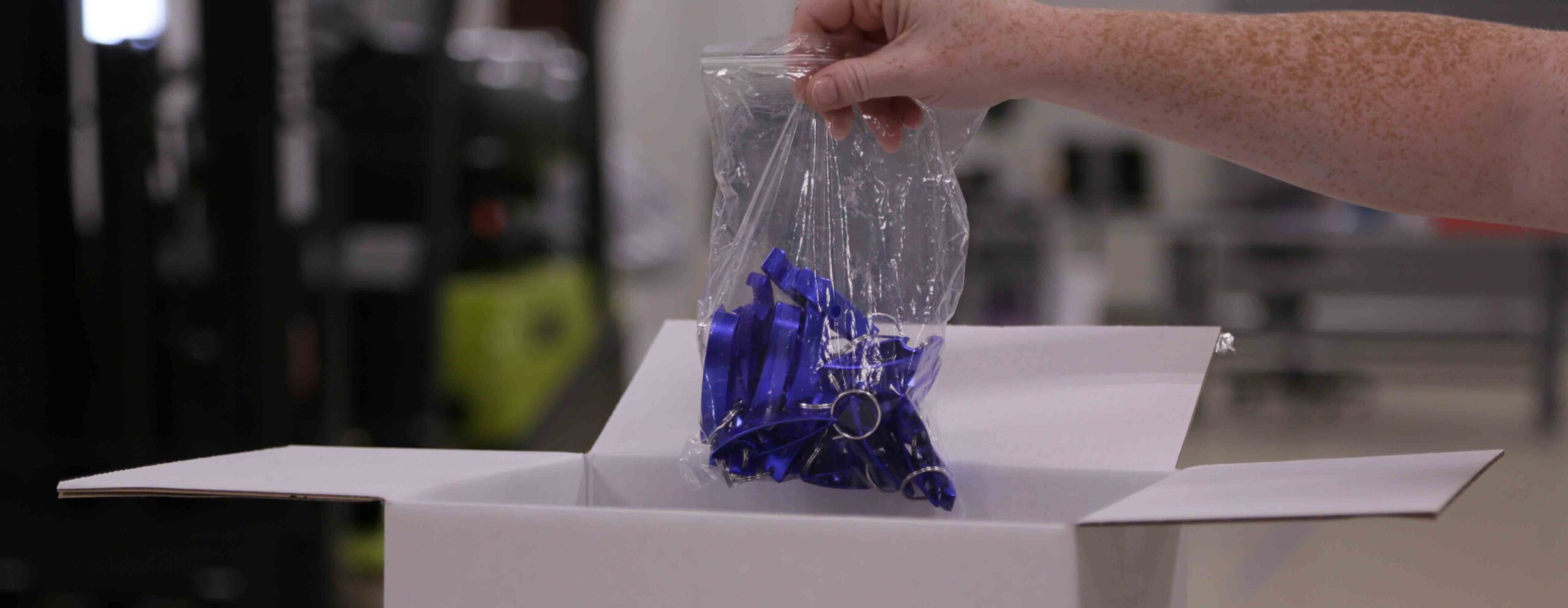 employee receiving parts out of a box